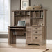 Teknik Louvre Hutch Desk in a Salt Oak Finish with Slide Out Keyboard/Mouse Shelf Multiple Storage Cubbyholes Within Hutch and Filer Drawer
