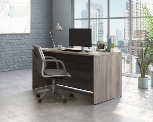 Teknik Affiliate 1500750 Desk in a Hudson Elm effect finish two grommet holes for cord management