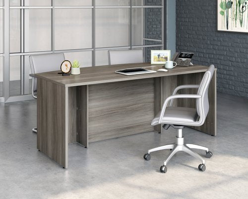 Teknik Affiliate 1800900 Bow Front Desk in a Hudson Elm effect finish two grommet holes for cord management
