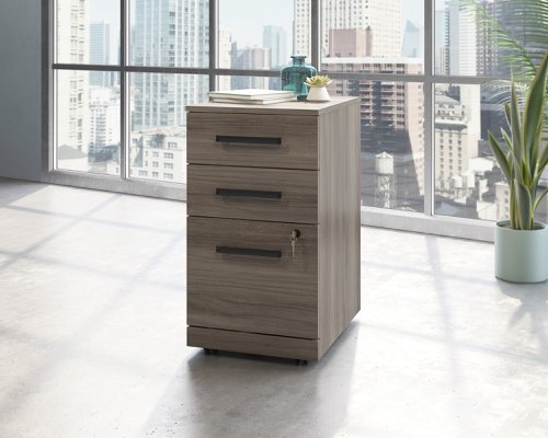 Teknik Affiliate 3 Drawer Mobile Pedestal in a Hudson Elm effect finish, two small drawers, one larger spacious filer lockable drawer
